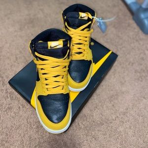 AIR JORDAN 1 HIGH OG, their black and yellow with a leather like material